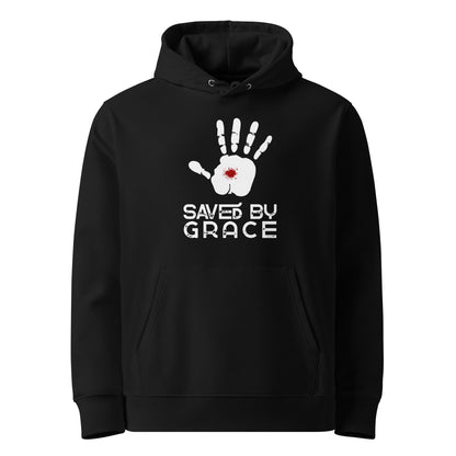 Schwarzer Unisex Hoodie aus 100% Bio-Baumwolle mit weißem Handabdruck, rotem Wundmal-Detail in der Handfläche und dem Schriftzug 'SAVED BY GRACE' – nachhaltige christliche Mode & Streetwear.